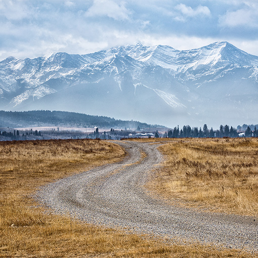 Prarie Road Leading to Rocky Mountains